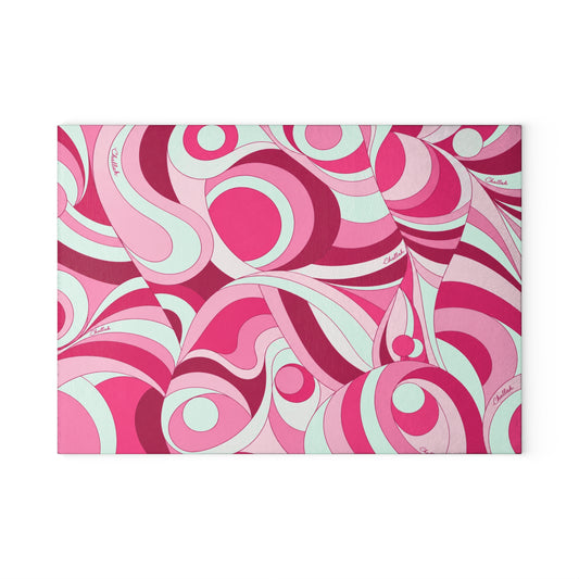 Pink psychedelic swirl print tempered glass challah board on a Shabbat table